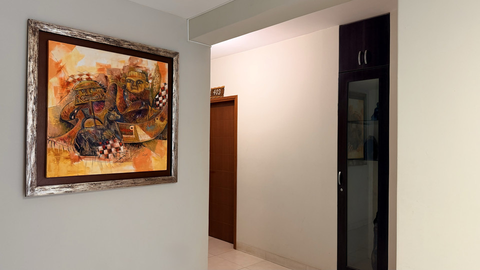 Interior hallway with decorative artwork and guest room doors